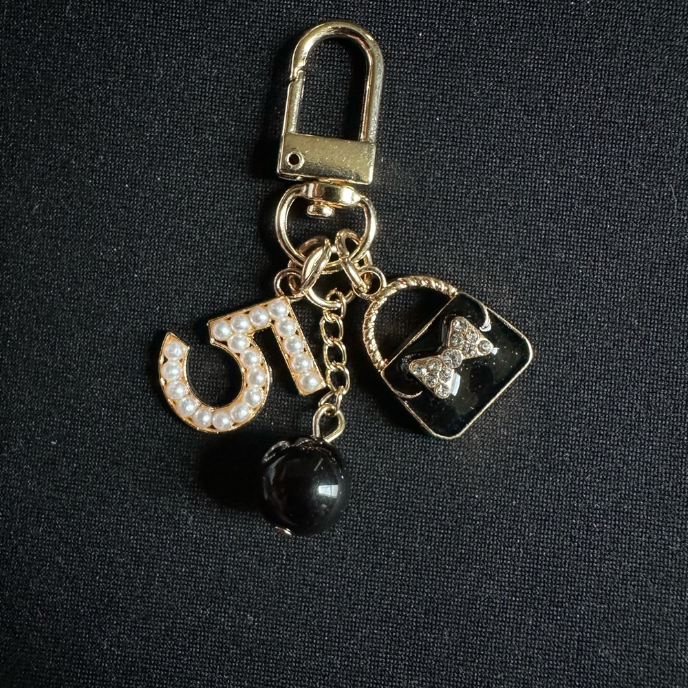 New Beautiful Bag Charm/ Key Chain in Gild and Black.